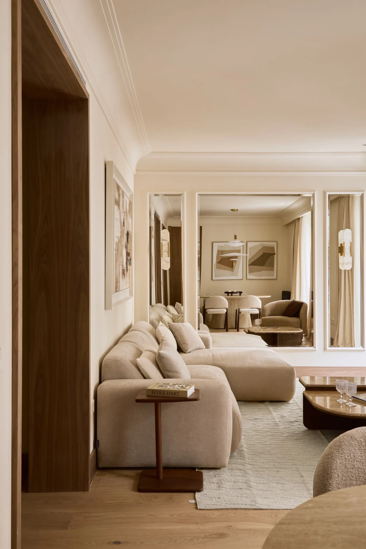 Living room seen from the hallway, with a mirror above the sofa