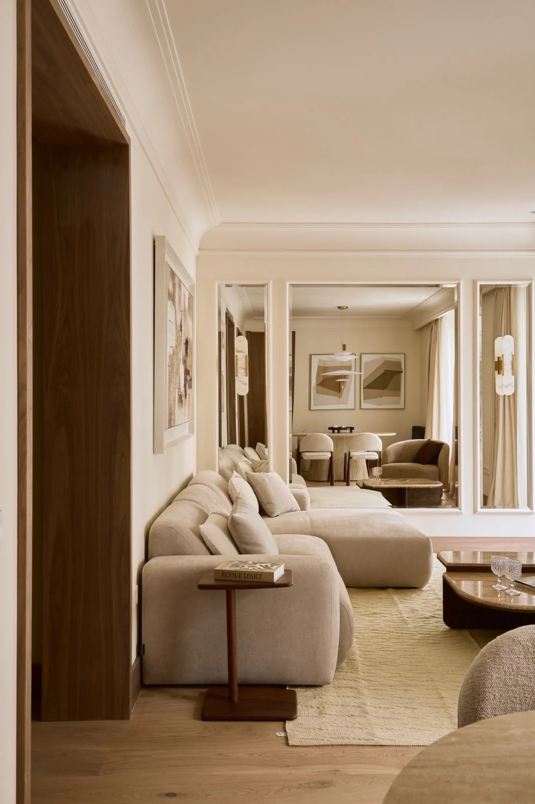 View of the living-room sofa and mirror from the hallway